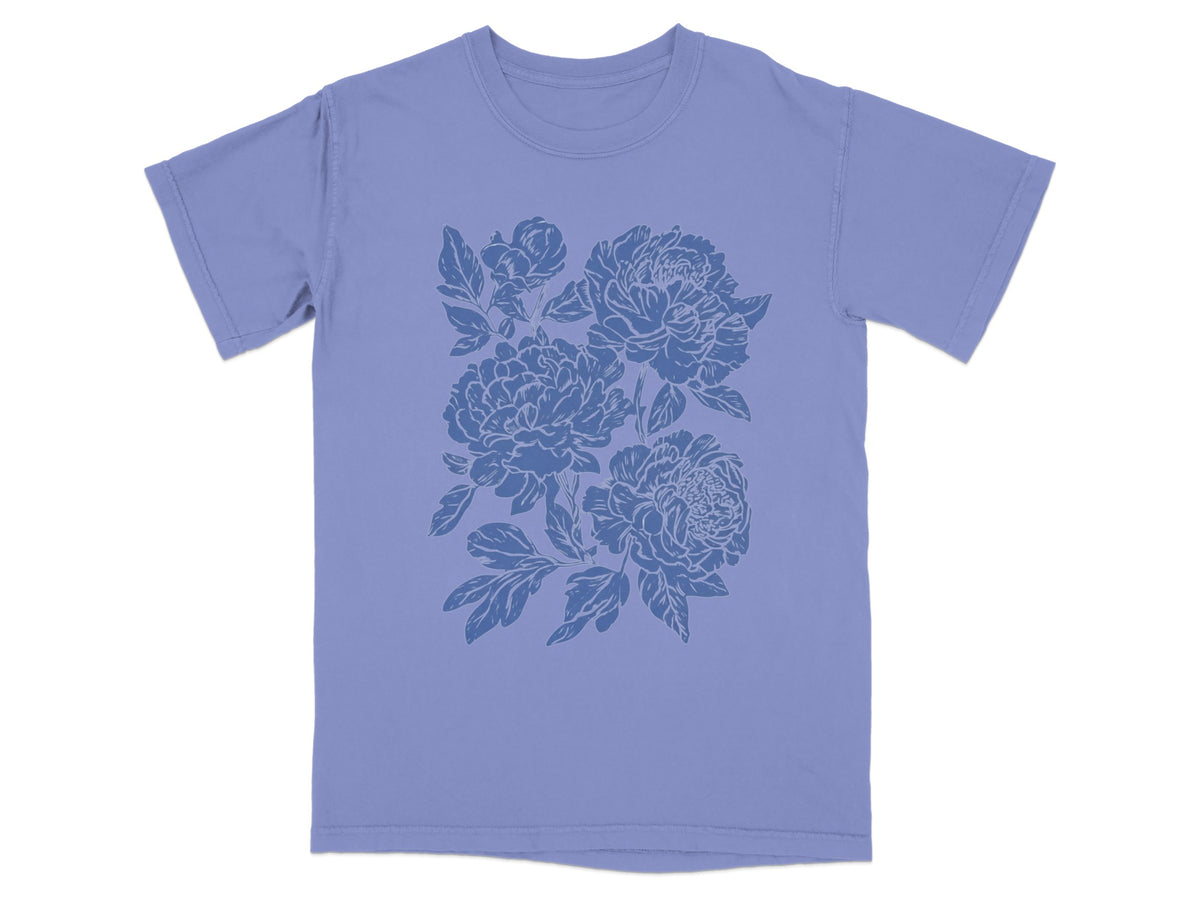 Floral Graphic Design T-Shirt with Blue Background